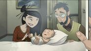 Infant Li with his parents