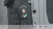 Rupert's badge on the side of his jacket.