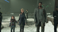 Alice, Kara, and Luther at the bus terminal in Battle for Detroit.