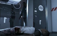 Chris closes the cell door and backs away from the HK400.