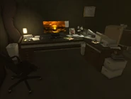 Adam Jensen's desk and computer