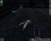 An unconscious NSF terrorist, note the lack of blood on the ground. Also shown is a riot prod, used to KO enemies.