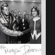 A young Megan Reed shaking hands with Hugh Darrow