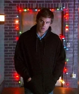 Dexter inside Brian's apt building