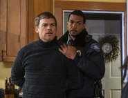 Dexter is handcuffed by Logan