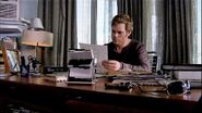 Dexter at his desk