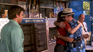 Angel hugs Debra when she returns to work