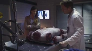 Dexter examines the body, looking for clues