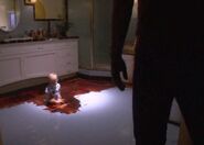 Dexter finds Harrison sitting in blood