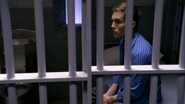 Quinn is held in a cell