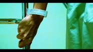 Laura Moser's medical bracelet confirming her D.O.B and Dexter's.