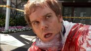 Dexter exits the bloody hotel room