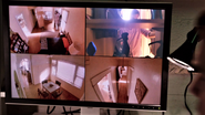 A.J. watches Dexter on security cameras