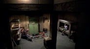 Scott held captive in a fallout shelter; Arthur plays with toy trains