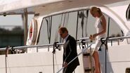 Hannah and man leave a yacht