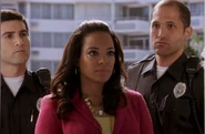 Maria at Dexter's door with two officers