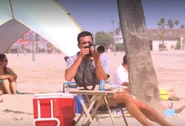 Nathan taking pictures on the beach