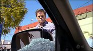 Window shattered by bullets S8E2