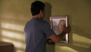 Dexter takes down Rita's picture