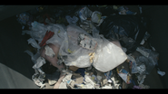 ...only to toss him back in later. (Last shot of Levi Reed before he's driven off to the dump)