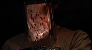 Blood spatter on Dexter's face shield