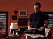 Dexter finds GPS warrants in Maria's house