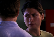 Nick talks with Dexter at prayer meeting