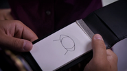 Angel thinks the "tattoo" looks like a UFO