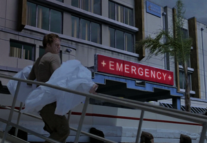 Dexter carries Debra to his boat from Miami Central Hospital