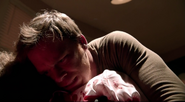 Dexter embraces Evelyn as she takes her final breath