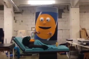Giant can in a behind the scenes video of DHMIS 5