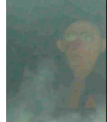 Once brightened up, you can see  standing eerily in the corner of the background