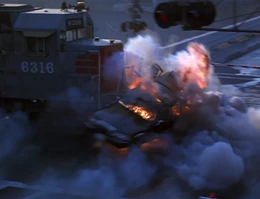 Deguerin and his conspirators are killed as their limousine is obliterated by the freight train.