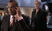 DHS- Charles Robinson (Colin Salmon) and M (Dame Judi Dench) in 007 Die Another Day (2002)