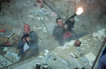 Jack McClane fires an AK-104