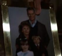 Young John Jr. (bottom right) in a family portrait in his mother's office.