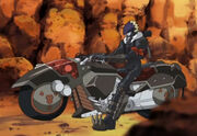 Beelzemon en su moto Behemoth y al lado esta Calumon