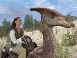 Marion riding a Parasaurolophus