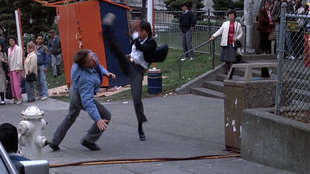 Al using his martial arts on a robber attempting to flee the restaurent