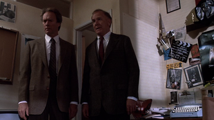 Harry with Captain Donelly in Harlan Rook's apartment