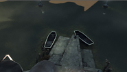 Two boats, one with a river krust growing in it.