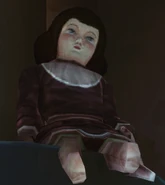 An Emily doll in the dressmaker's apartment.