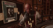 Vice Overseer Liam Byrne looks contemplative in front of a wanted poster for Paolo.