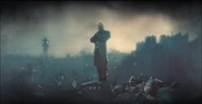 Daud atop a pile of corpses.