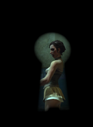 Corvo uses a keyhole to spy on a courtesan.