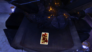 A bloodied tarot card sits on an Outsider Shrine.