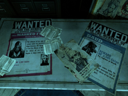 Wanted posters in Daud's office.