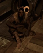 A beggar in the Dust District.