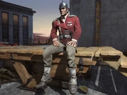 A male Elite Guard guarding a windmill near the Royal Palace.