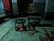 Torture implements and a firepit next to the interrogation chair at Coldridge Prison.